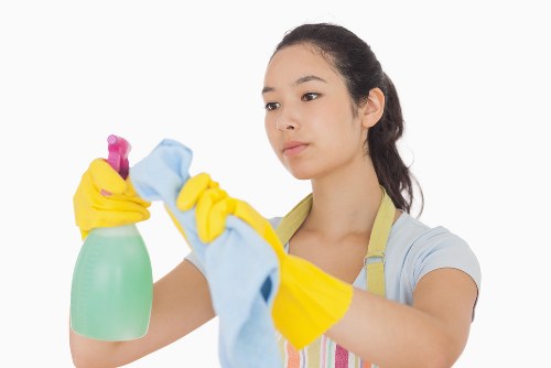 Worker following safe procedures during a carpet cleaning job