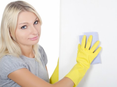Technician checking cleaning products and equipment for safe use
